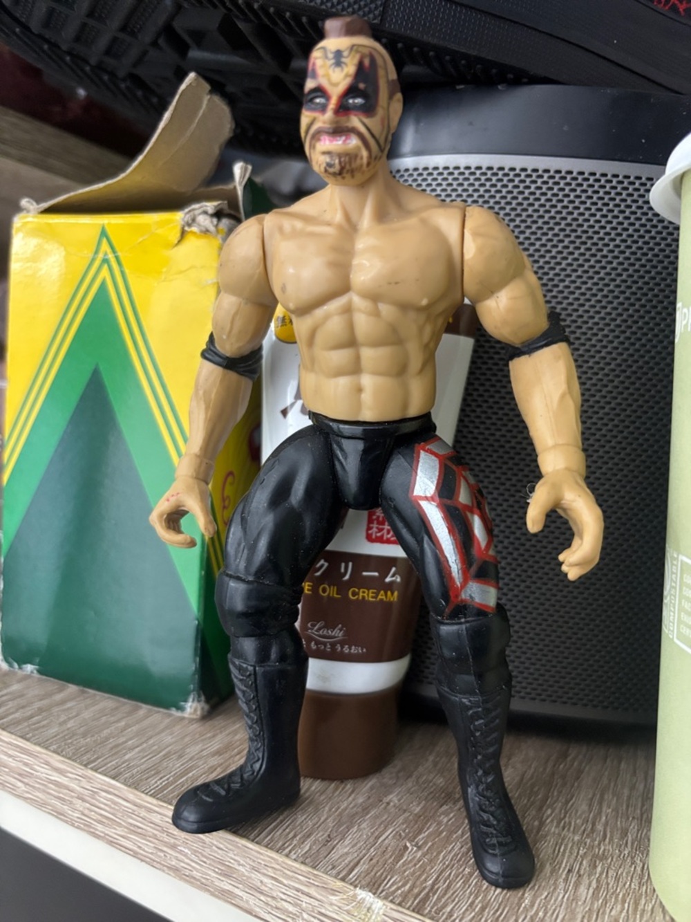Masked Wrestling Action Figure with Painted Face and Black Gear